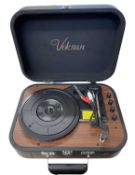 A cased Voksun 7" record player with built in speakers