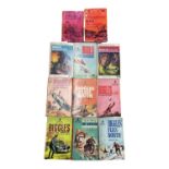 A collection of Biggles paperback books, to include: - Biggles and the Blue Moon - Biggles Flies