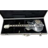 An acrylic clear-body Les Paul-shaped electric guitar, with no makers mark, within generic silver