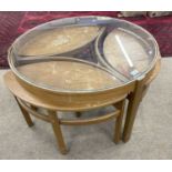 A Nathan Trinity nest of tables with central glass topped table and three further small teak pull