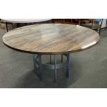 Merrow Associates rosewood veneered pedestal dining table with circular top raised on a chrome