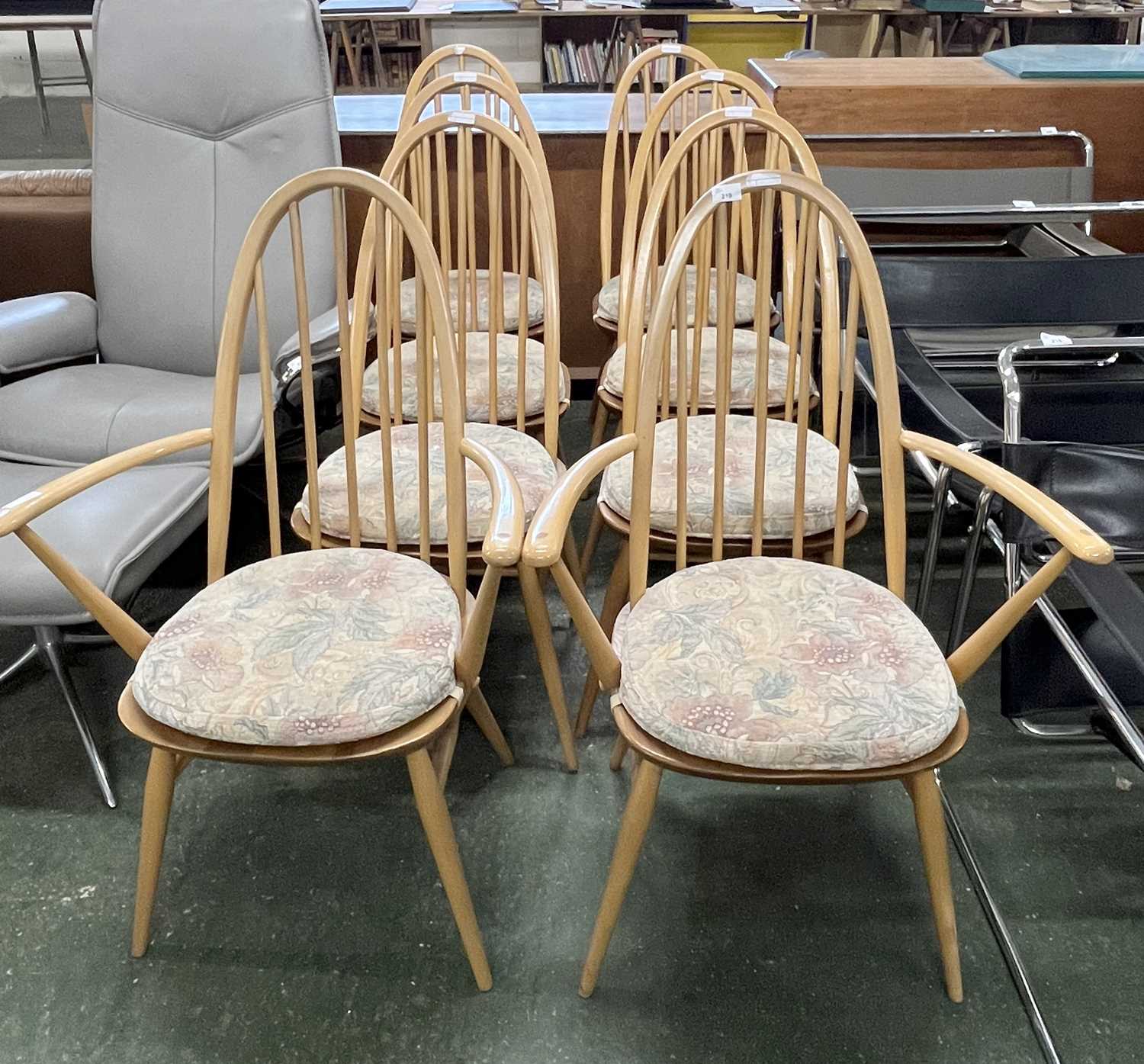 A set of eight Ercol hoop and stick back dining chairs with removeable seat cushions