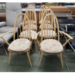 A set of eight Ercol hoop and stick back dining chairs with removeable seat cushions