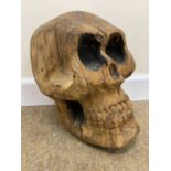 Attributed to David Chedgey (British, b.1940), Carved wood skull sculpture, 12x20cm approx.