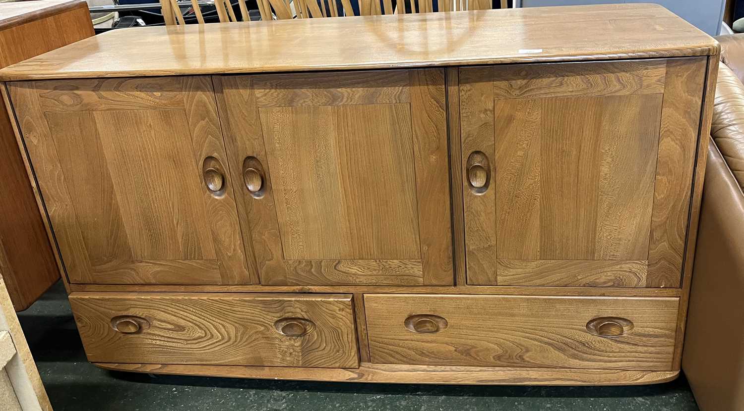 An Ercol light elm sideboard with three doors over two drawers, 130cm wide - Image 2 of 3