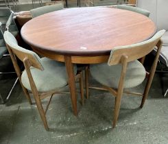 A G-Plan teak extending dining table and four accompanying chairs, table 120cm diameter