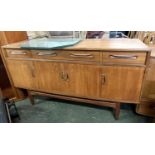 Mid Century teak G-Plan sideboard with three drawers over four doors, 151cm wide