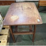 A Danish hardwood mid Century two tier coffee table with slightly galleried rectangular top over a