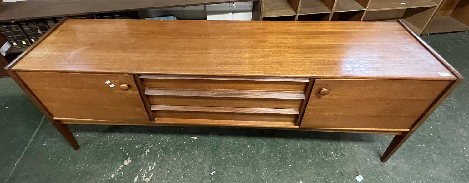 A mid Century teak sideboard with two end doors and three central drawers raised on tapering legs, - Image 2 of 2