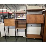 A Ladderax teak and iron framed room divider or shelf unit incorporating bureau section, a glazed