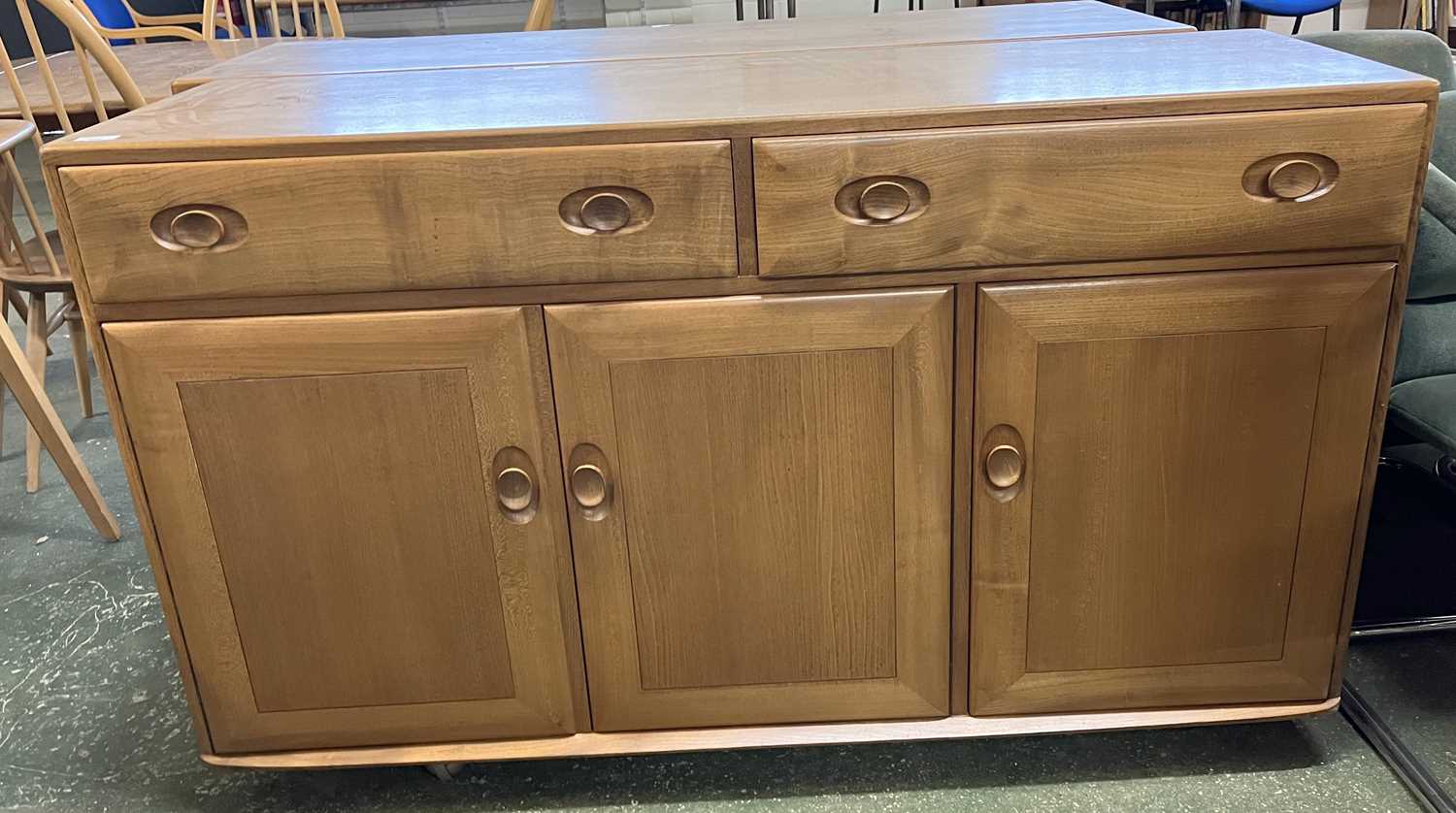 An Ercol light elm sideboard with two drawers over three panelled doors, 136 wide - Image 2 of 2