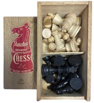 A wooden boxed set of Staunton chess pieces