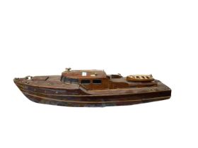 A motorised wooden boat model, length approximately 87cm