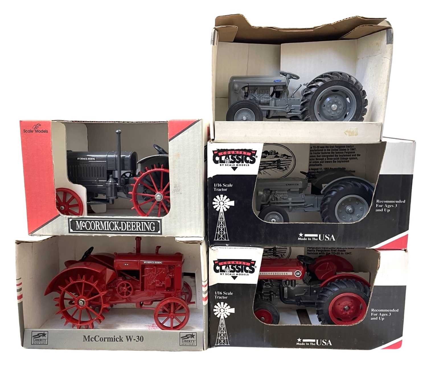 Five boxed die-cast tractor models, to include: - Country Classics Massey Ferguson 135 - Country