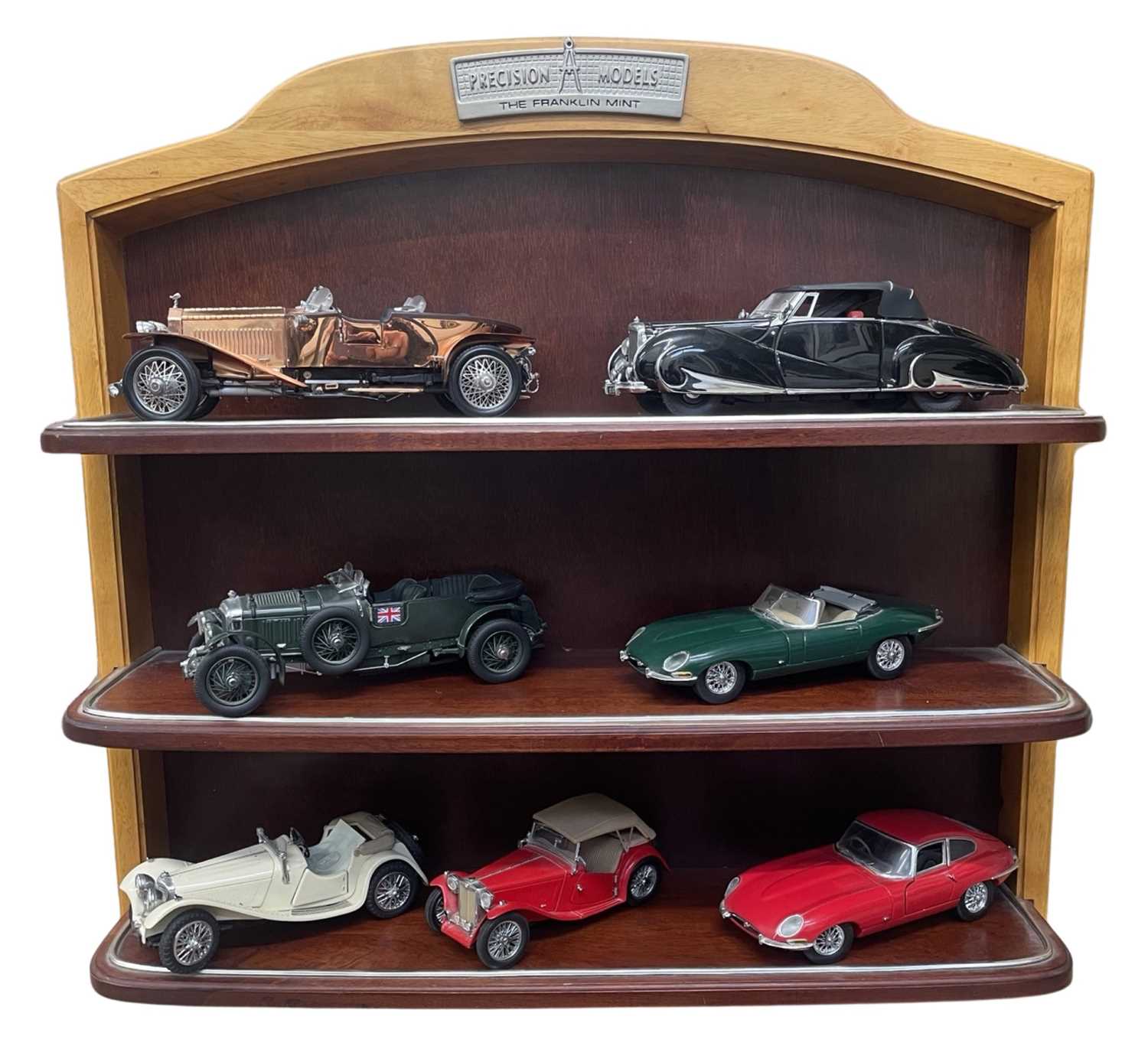 A Franklin Mint branded shelf, 'Precision Models', together with various scale model cars and