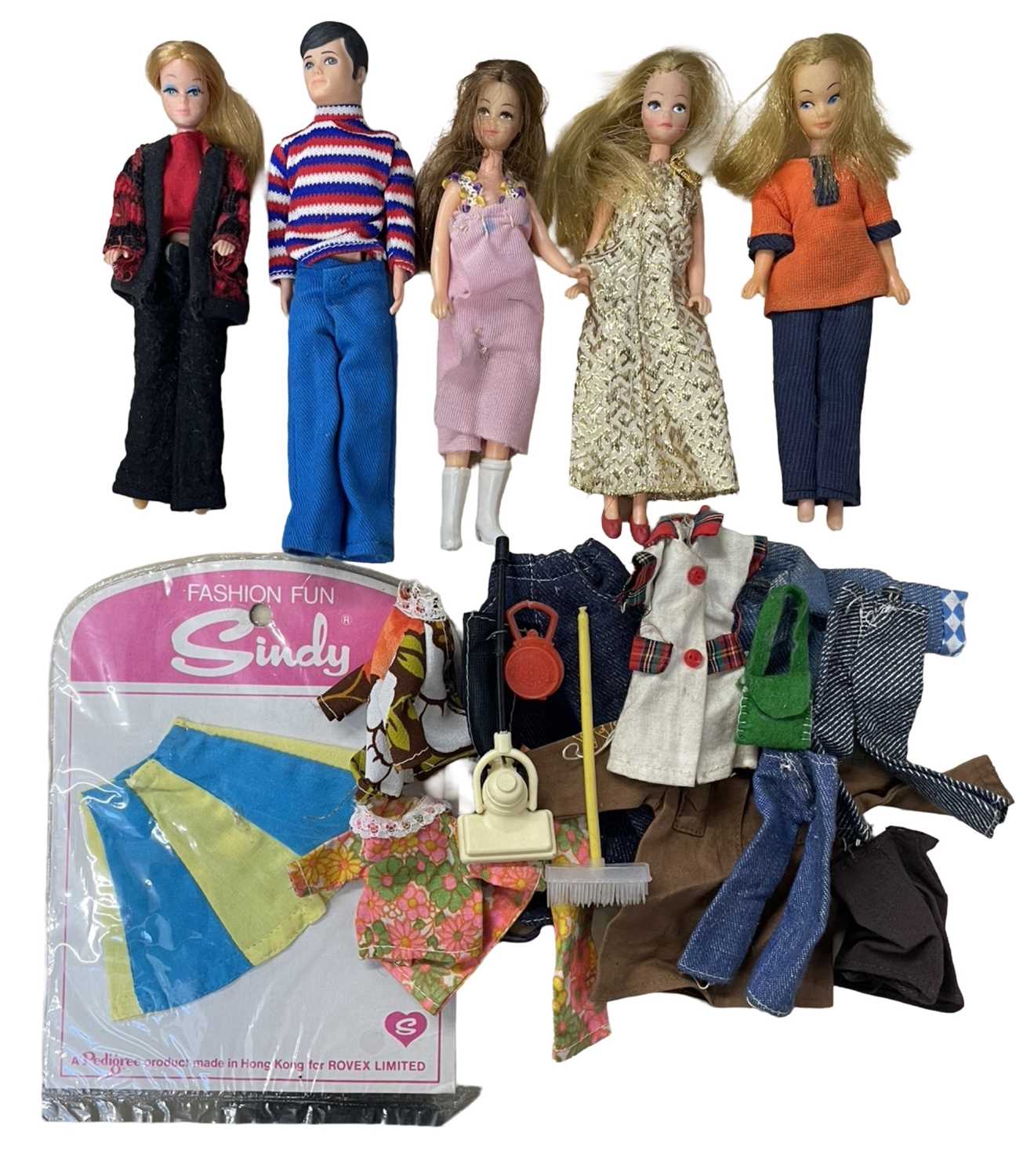 A collection of four vintage Pippa Dolls / one Pete doll, together with dolls clothing