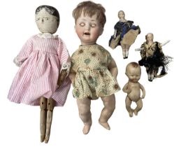 A mixed lot of various dolls, to include: - A Hermann Steiner bisque head baby doll in floral dress.