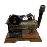 A vintage Marklin stationary steam engine, stamped to base A W Gamage, Holborn, London