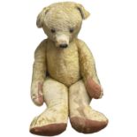 An extremely large straw-filled Merrythought Teddy Bear, most likely used for shop display. With