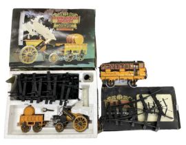 A boxed Hornby G100 3 1/2'' gauge Stephensons Rocket real steam train set, together with G103 Pair