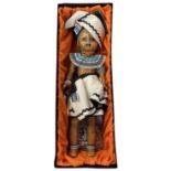 A boxed AboSisi Sisters of Africa doll, 'Xhosa Woman' handmade from newspapers in traditional tribal