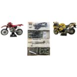 A pair of boxed Matchbox Aeroplane 1:32 scale building kits, plus a pair of built motorcycles