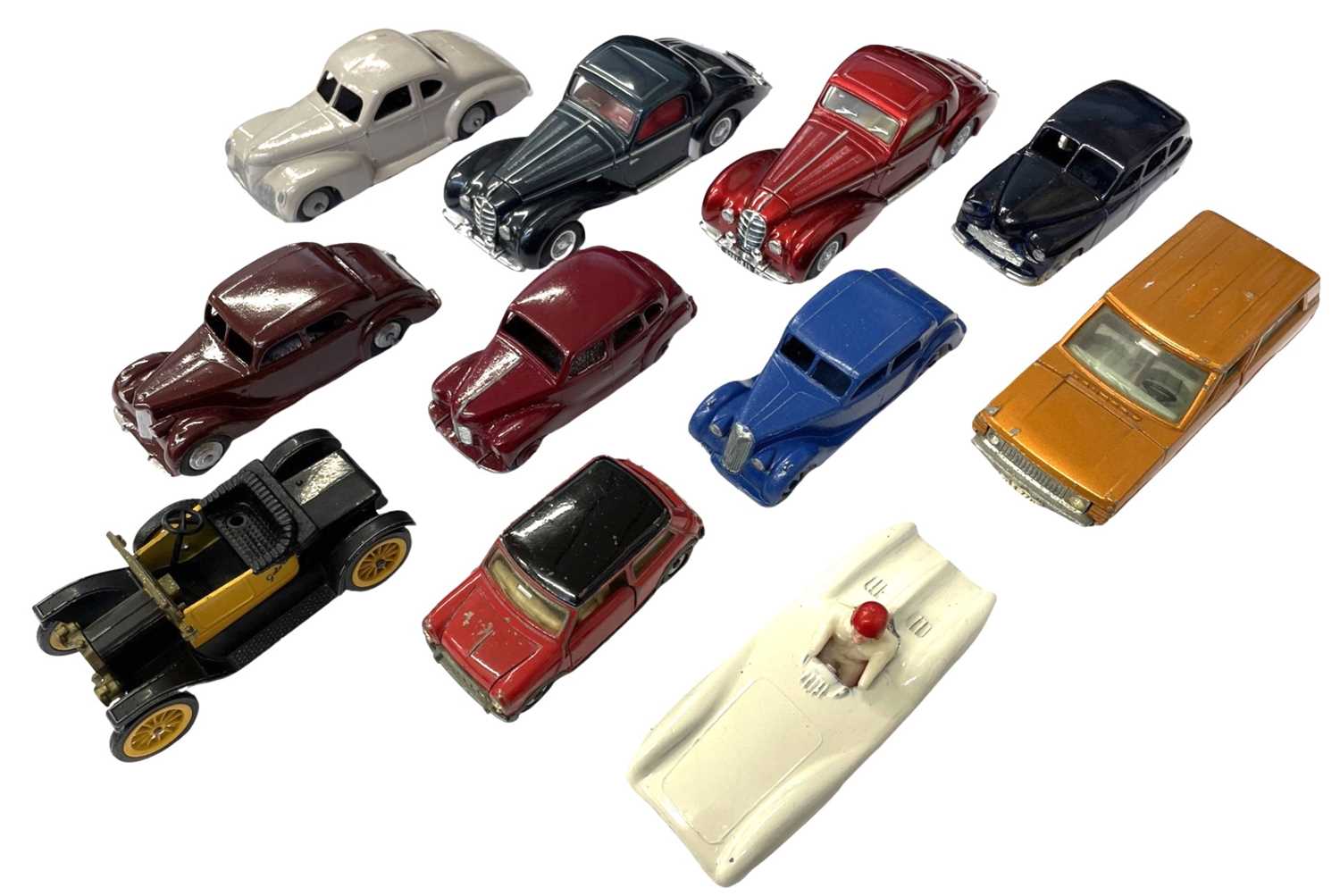 A collection of various die-cast Dinky Toy cars