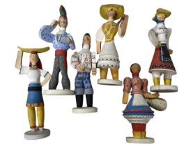 A collection of 6 Continental, hand-painted wooden dolls.