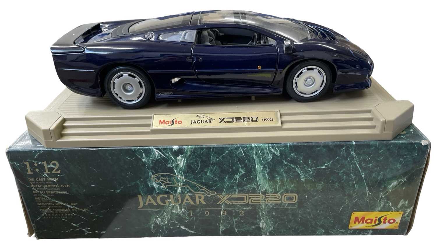 A Maisto 1:12 scale model Jaguar XJ220 (1992) in dark blue