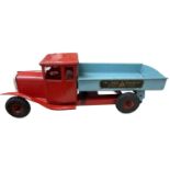 A c1950s Triang Transport flatbed tipper truck.