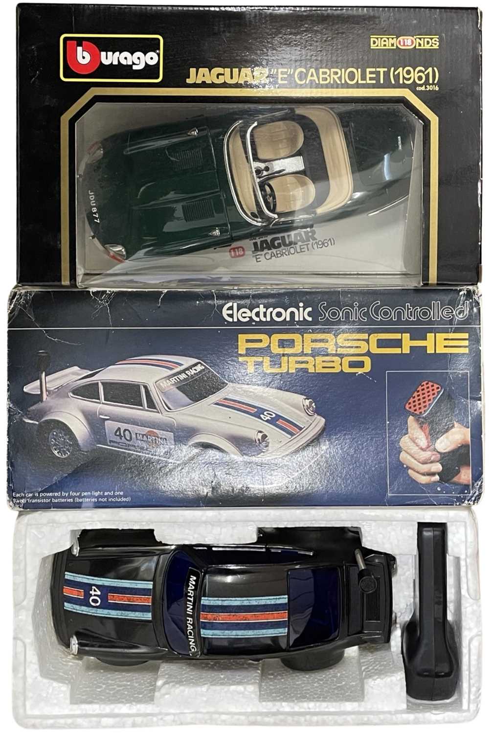 A pair of boxed car models, to include: - An electronic sonic controlled Porsche Turbo by Rojo