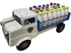 A c1950s Triang pressed steel milk float, with 28 original bottles with Triang branded caps.