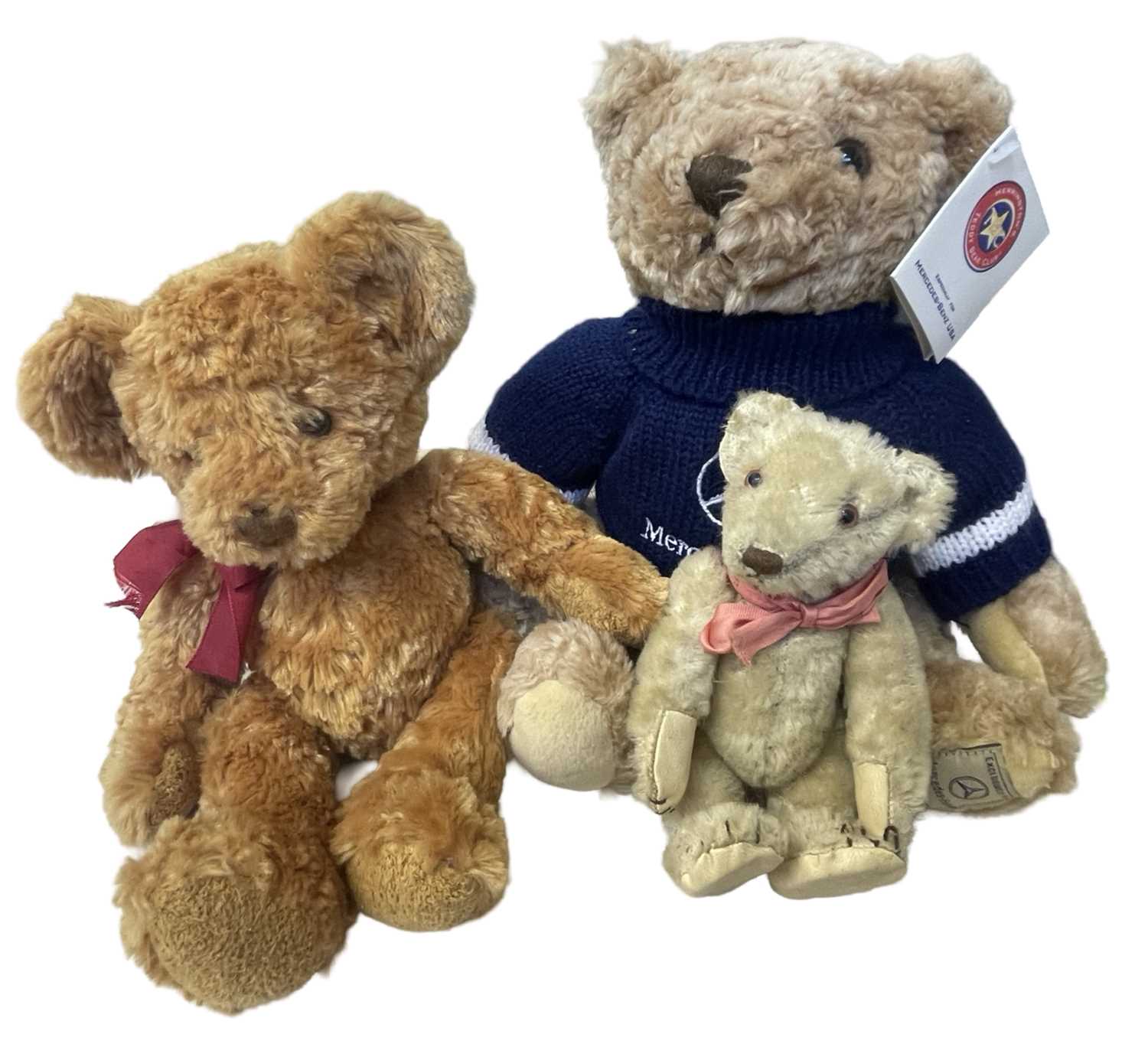 A mixed lot of teddy bears, to include Mercedes Promotional Bear, Russ, a small vintage bear with