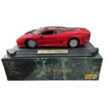 A Maisto 1:12 scale model Jaguar XJ220 (1992) in Red