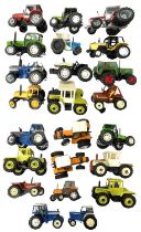 A collection of various die-cast and plastic model tractors.