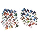 A large collection of various small scale die-cast tractor models
