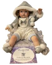 A Regency Fine Arts porcelain doll, 'Amy', with original certificate. length approximately: 52cm