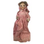 A bisque head Gebruder Heubach Einco 'Googly eye' doll, in pink spotted dress, woollen under-