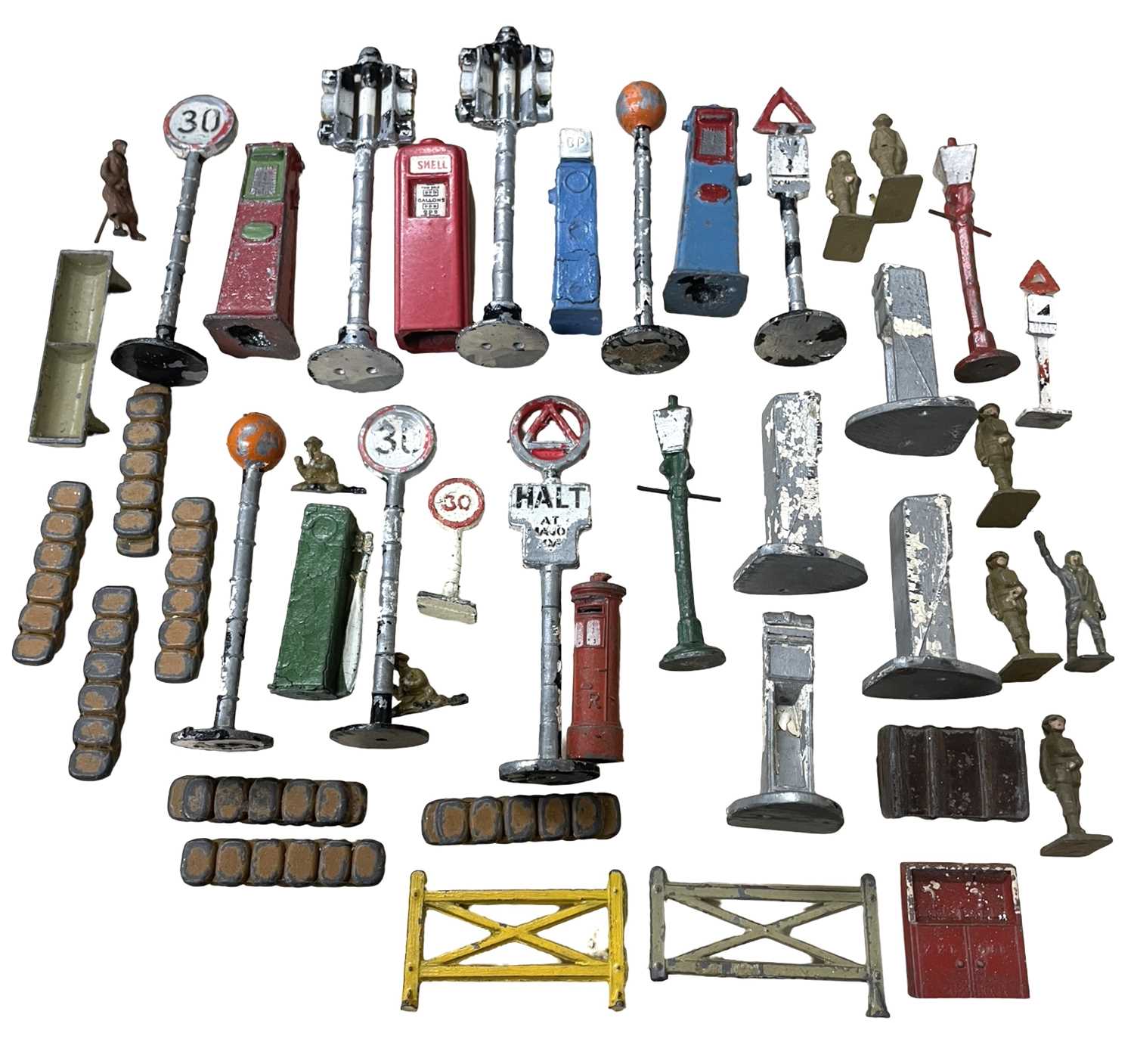 A collection of die-cast signage, petrol pumps, figures etc