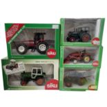 Five boxed Siku 1:32 scale tractor models, to include: - 3460 Hanomag R45 - 2868 Massey Ferguson