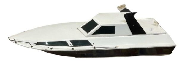 A large remote controlled speedboat on stand. Length approximately 96cm