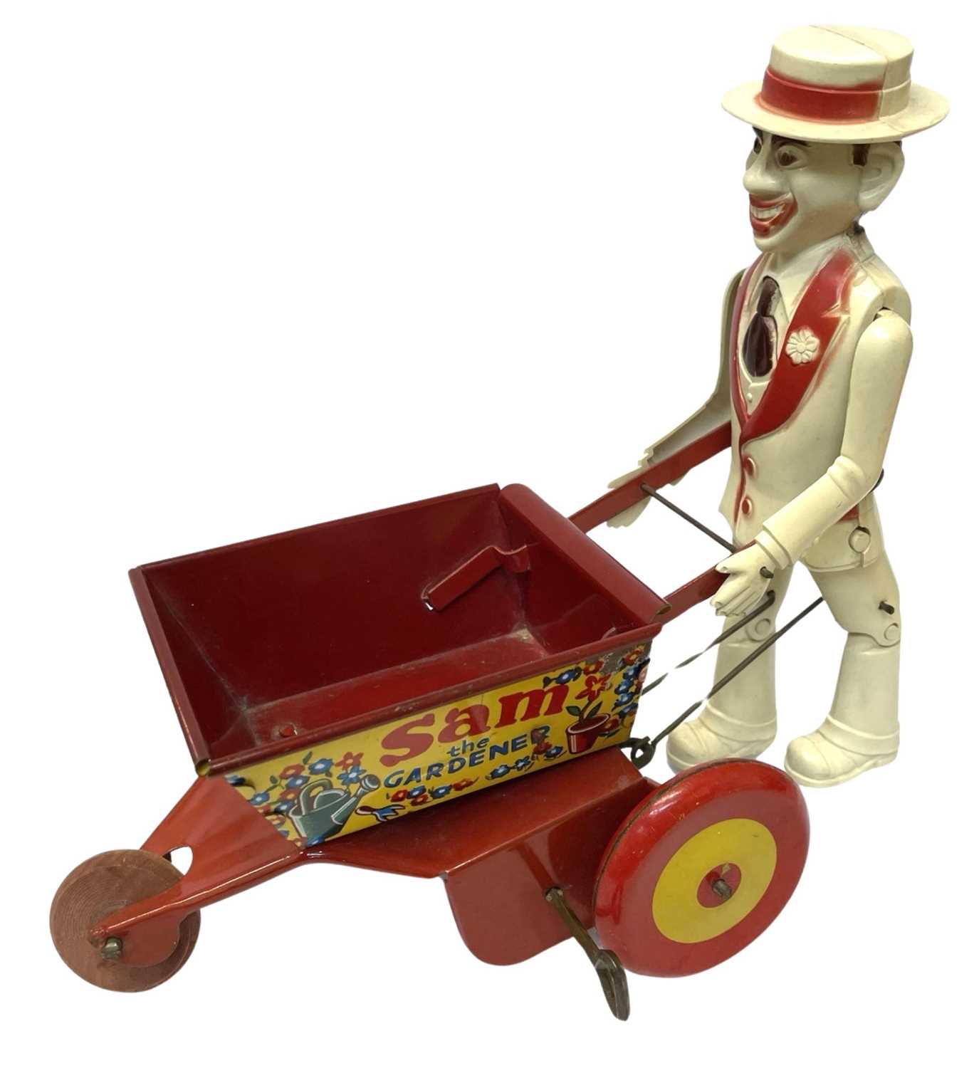 A tinplate and plastic Sam the Gardener clockwork toy by MARX