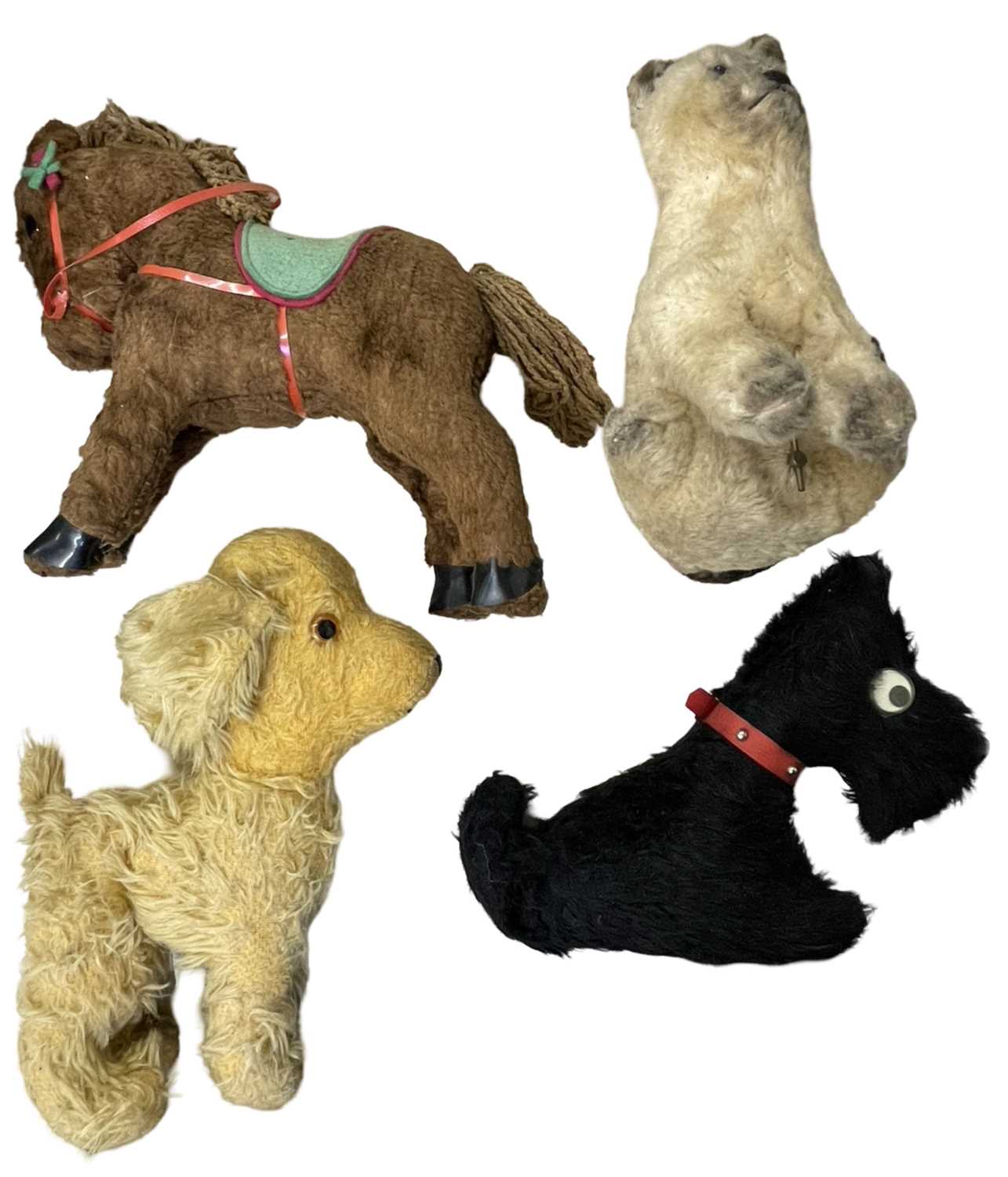 Four vintage stuffed toys to include horse, 2 dogs and a wind-up musical cat