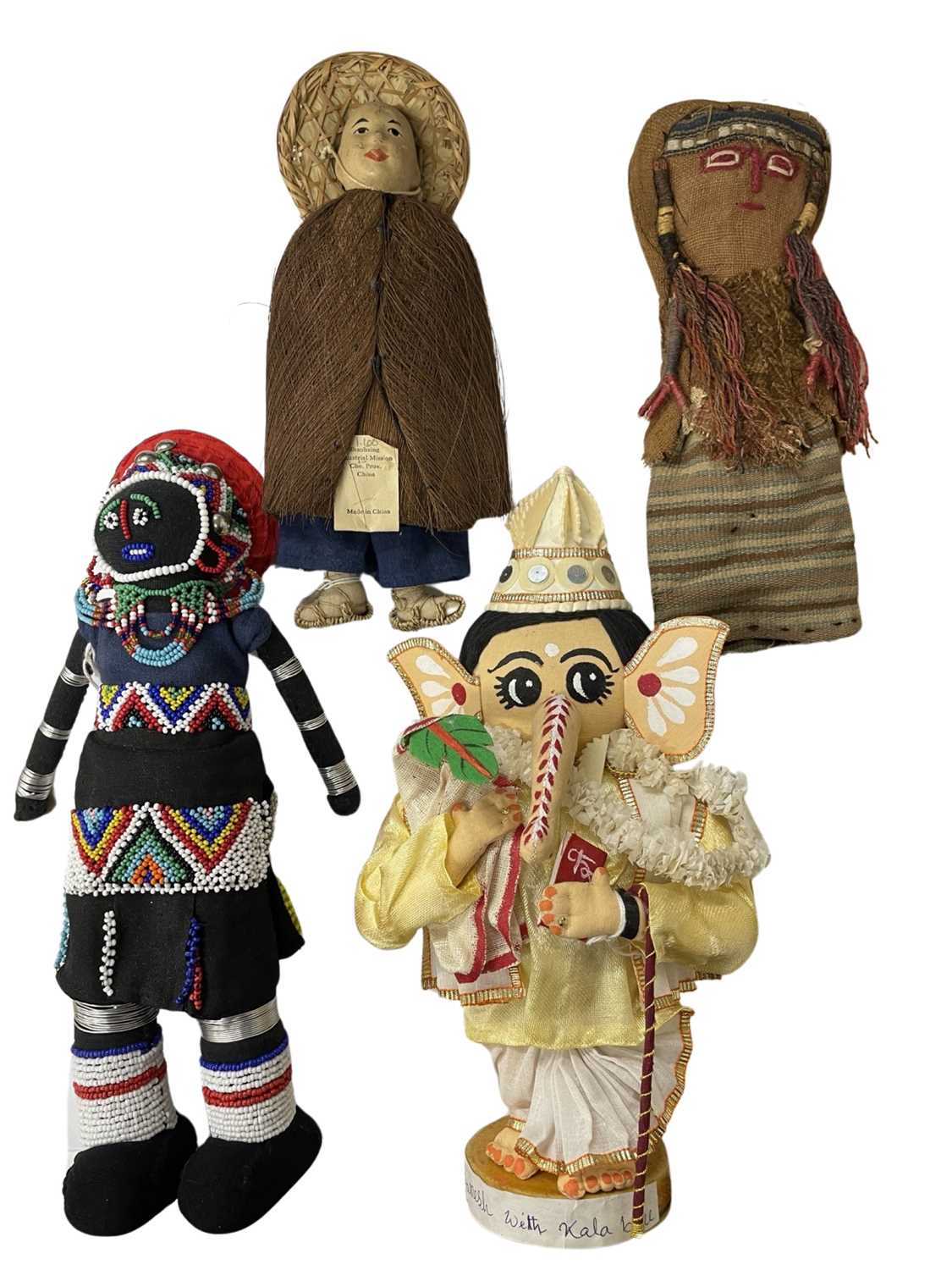 Four very interesting cloth world dolls, to include: - Ganesh with Kala Ball (purchased in