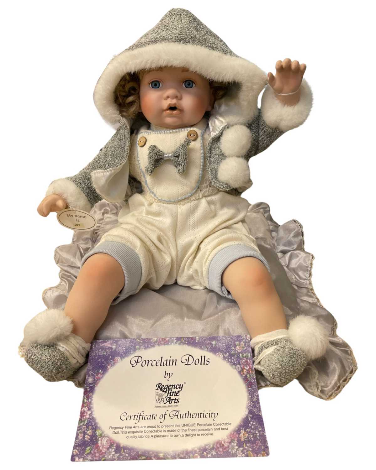 A Regency Fine Arts porcelain doll, 'Amy', with original certificate. length approximately: 52cm