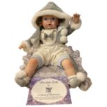 A Regency Fine Arts porcelain doll, 'Amy', with original certificate. length approximately: 52cm