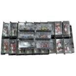 An extensive collection of approximately 60 cased 1:42 scale die-cast Formula 1 racing cars with