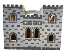 A wooden Melissa and Doug play castle