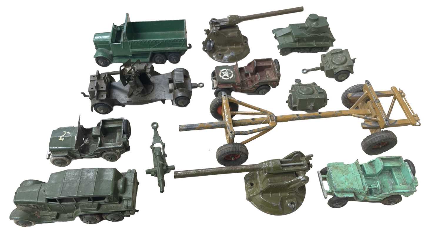 A group of Dinky toy military vehicles, playworn and some repainted