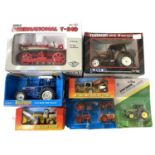 A mixed lot of various boxed ERTL agricultural vehicles